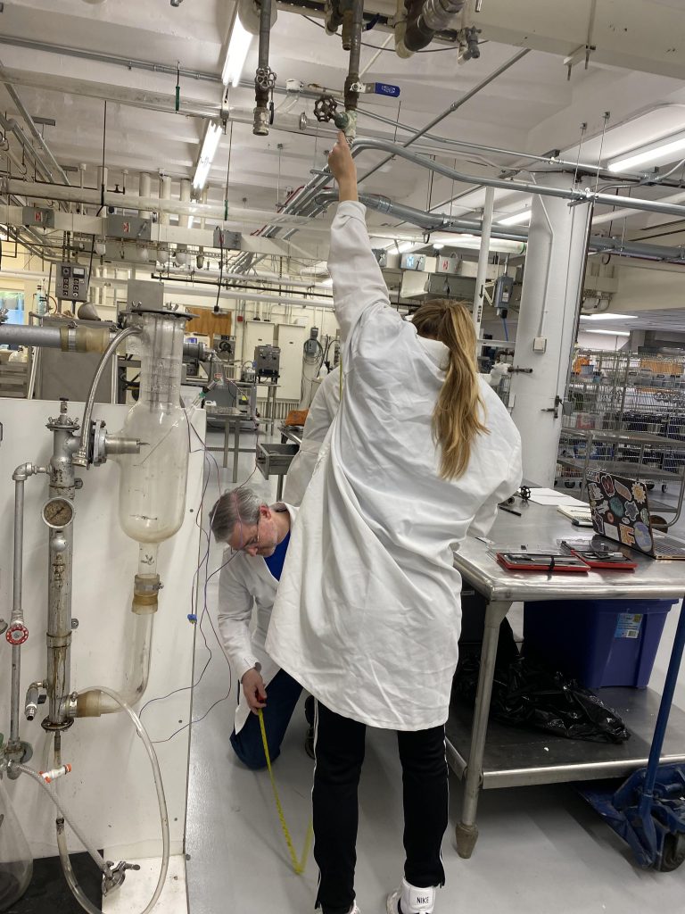 Emily and Dr. Jackson measure the height of the cold water input in the FSHN lab.