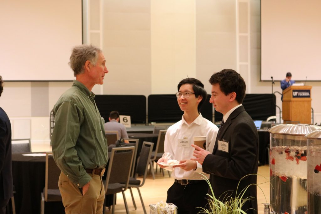 Dr. Jorg Peters, Jason, and Brian talking at the Reitz Union Rion Ballroom.